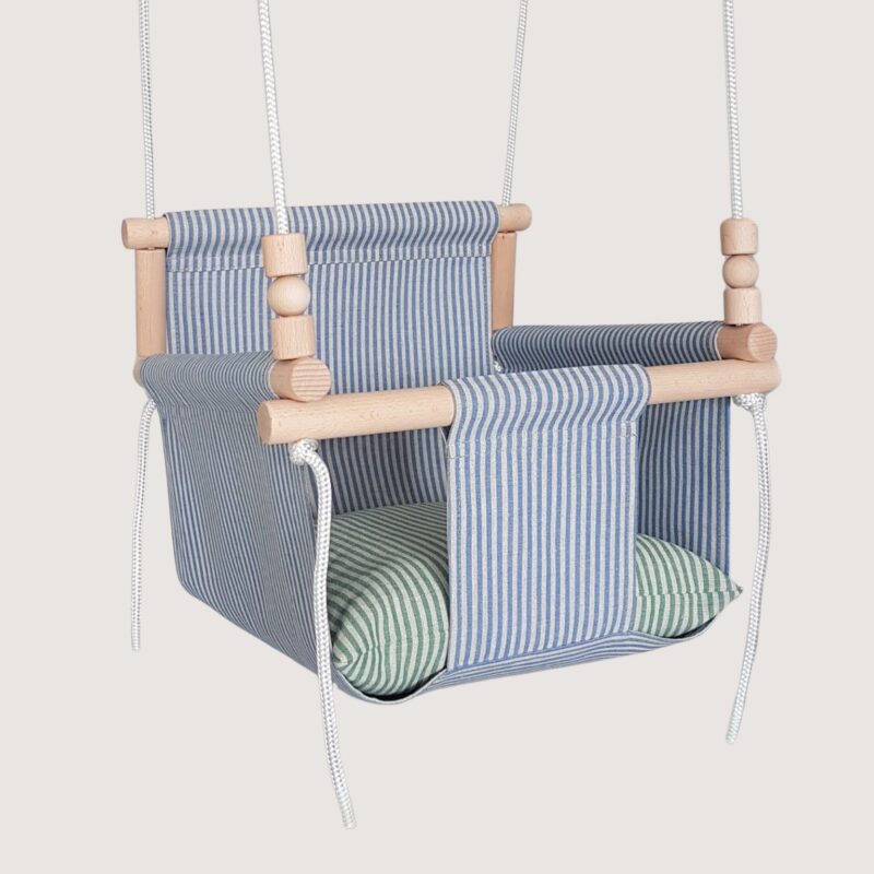 Linen baby swing with green striped pillows
